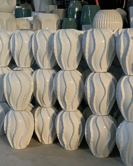 Glazed ceramic vases stacked in production in China
