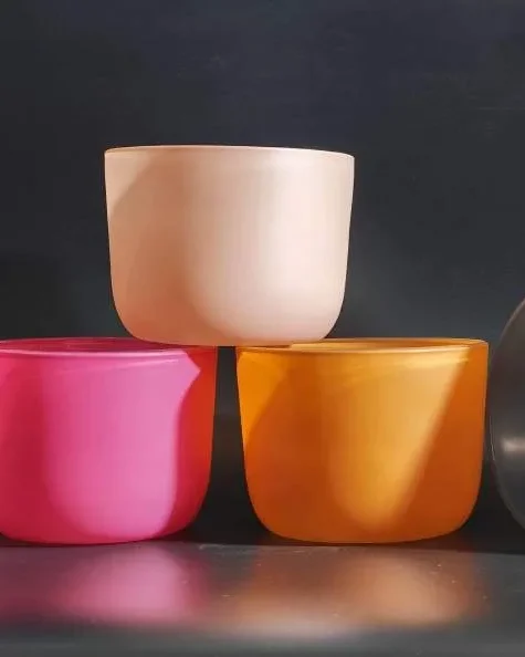 Spray-colored glass candle vessels made in Vietnam