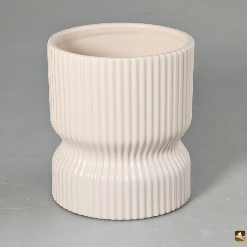 Fluted white ceramic candle vessel