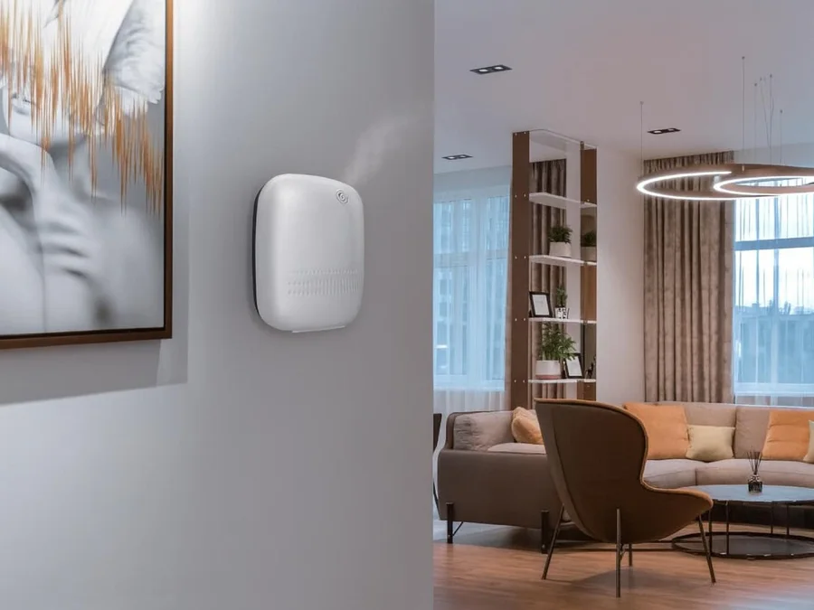 White wall-mounted scent diffuser in a hallway