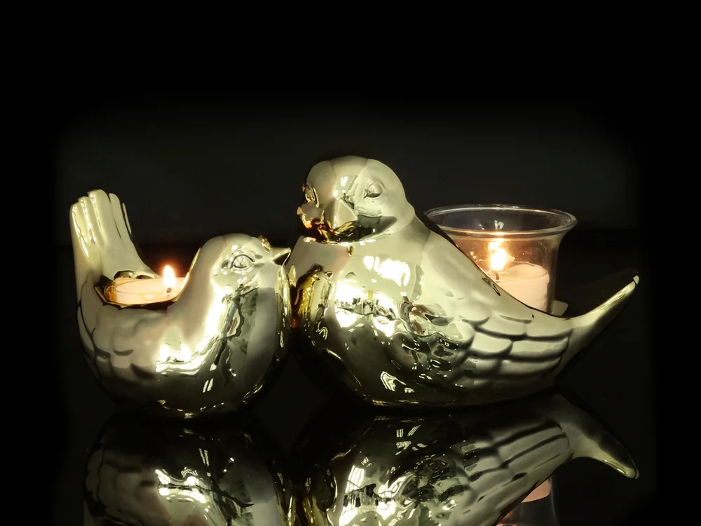 Pair of gold ceramic birds with a tealight