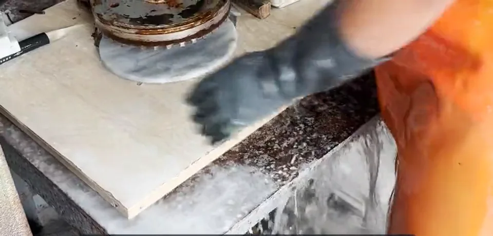 Hand polishing a marble board