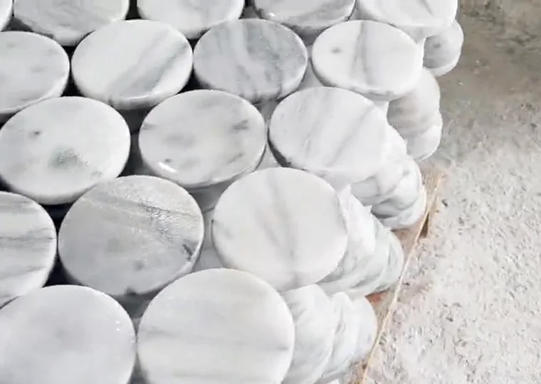 Stacked Hualien marble discs showing natural veining