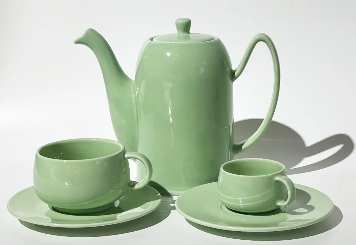 Celadon-green teapot with cups and saucers