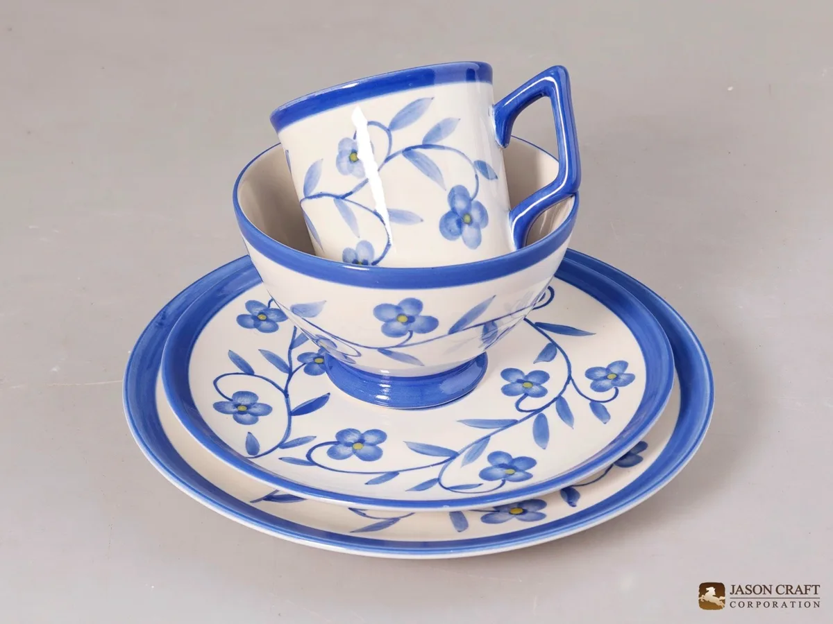 Hand-painted blue floral mug, bowl and plate