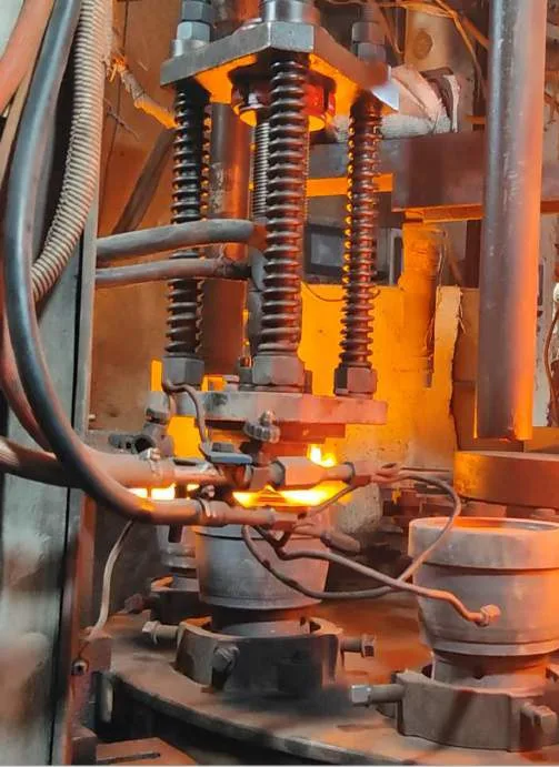 Hot glass press-forming machine with a glowing mold