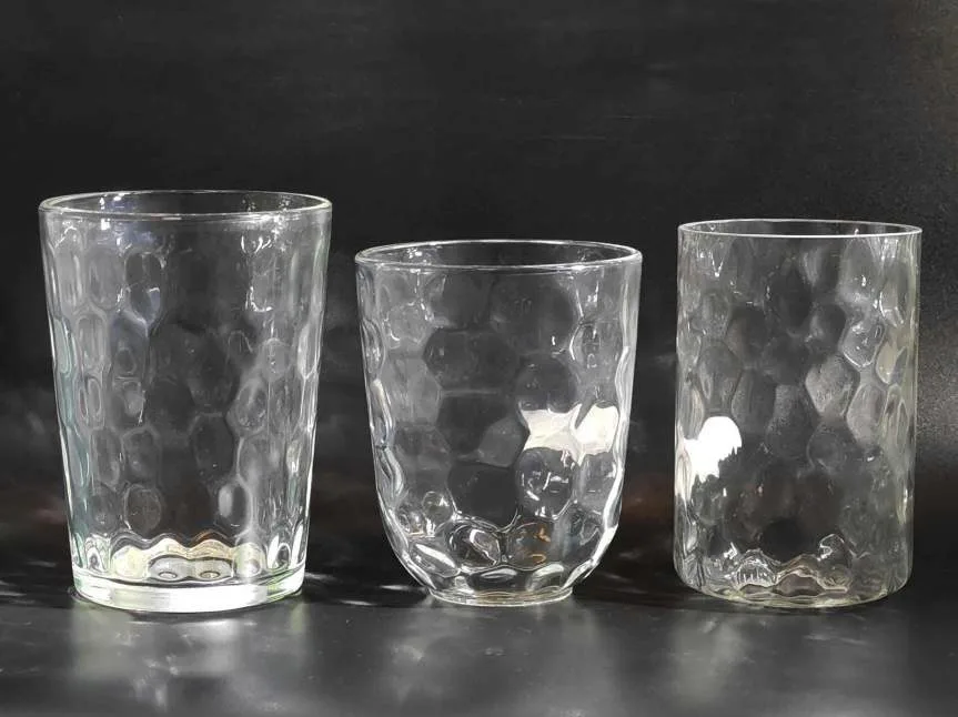 Three hammered-texture glass tumblers