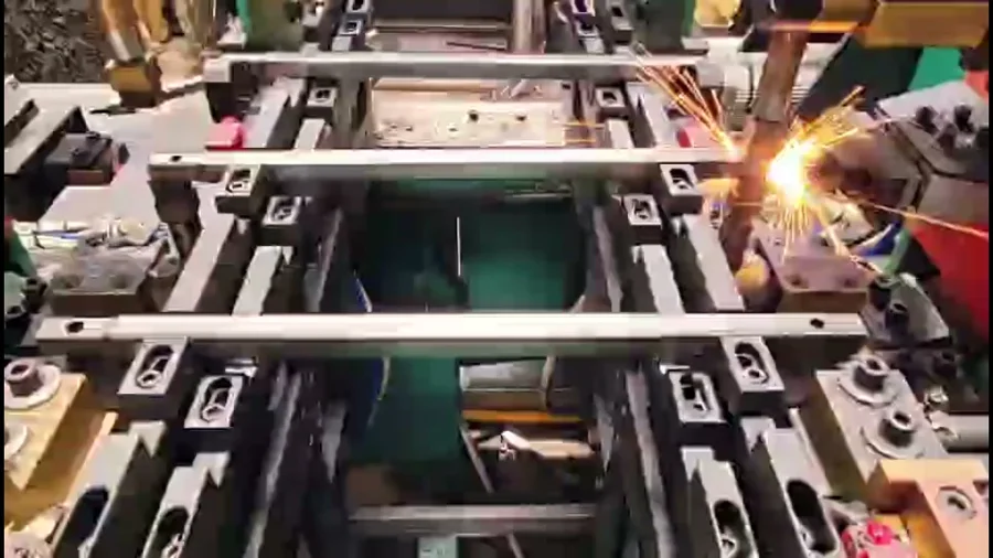 Welding sparks on a frame welding jig